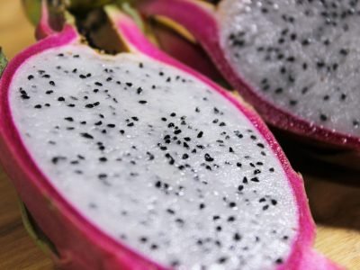 Detailed close-up of sliced dragon fruit with vibrant colors highlighting tropical freshness.